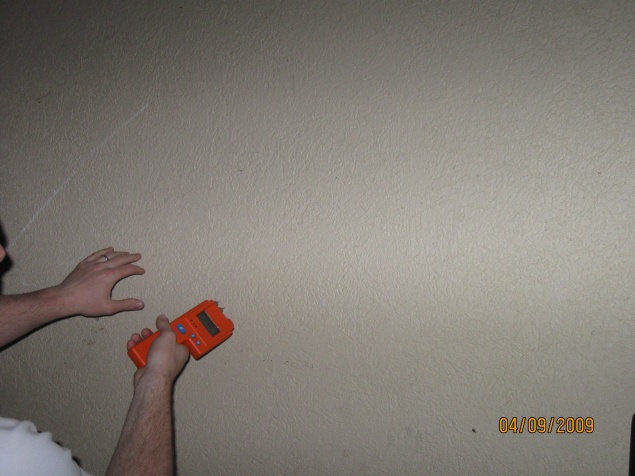 Use of moisture meter to determine the level of moisture in drywall